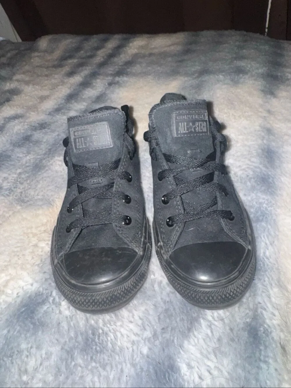 All black low top Converses size youth 3